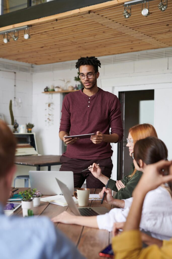 Young professionals engaged in a brainstorming session in a modern office setting.